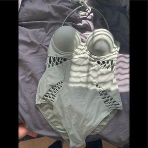 Green bathing suit with cutouts